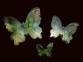 Three butterfly-shaped translucent green wall decor 