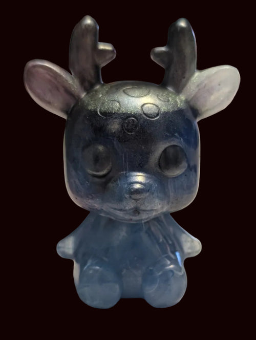 A small blue translucent figurine of a cute deer with antlers