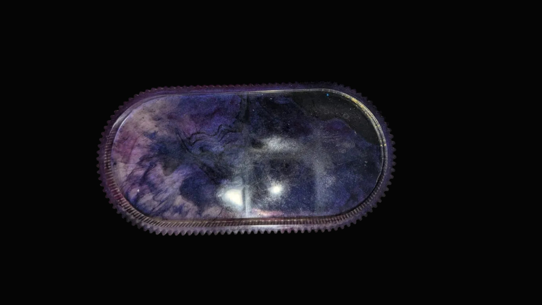 Black and purple swirl oval tray with ridged edges, perfect for small trinkets.